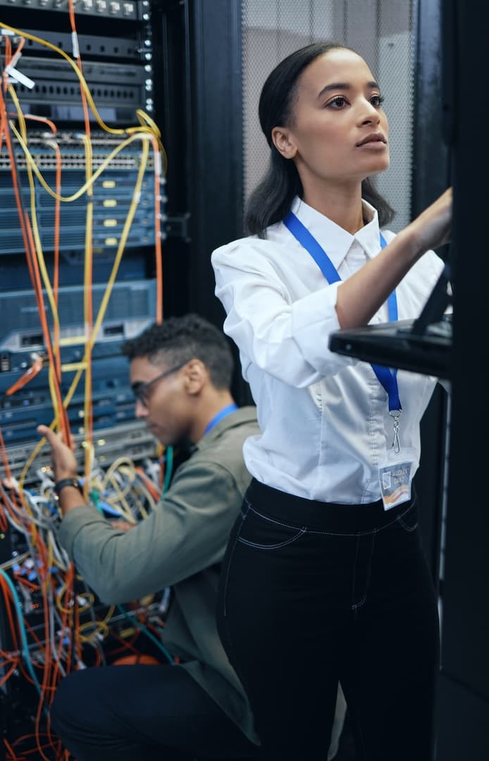 https://concertium.com/wp-content/uploads/2024/01/cropped-shot-of-two-young-computer-programmers-work-at-concertium.jpg